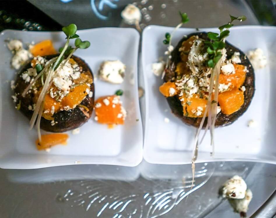 Gourmet stuffed mushrooms with herbs and cheese.